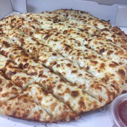 Korner Slice - Cheesy breadsticks with marinara dipping sauce.