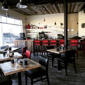 La Basse Cour - tables and chairs in a restaurant - Canadian (New) Near Me - Coteau-du-Lac, Quebec La Basse Cour - tables and chairs in a restaurant - Canadian (New) Near Me - Coteau-du-Lac, Quebec