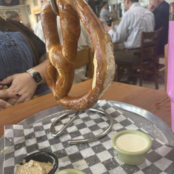 Honor Cafe Conroe - Hot pretzel with a gravy sauce, a stone ground mustard dip, and white queso sauce - Breakfast & Brunch Near Me - Conroe, Texas