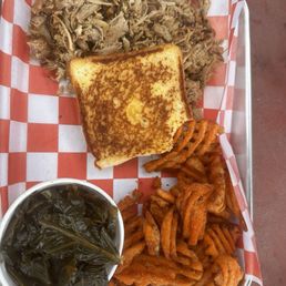 Pulled pork, collard greens, and sweet potato fries Pulled pork, collard greens, and sweet potato fries