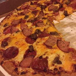 Sausage, pepperoni, Canadian bacon, and cheese curds. Sausage, pepperoni, Canadian bacon, and cheese curds.