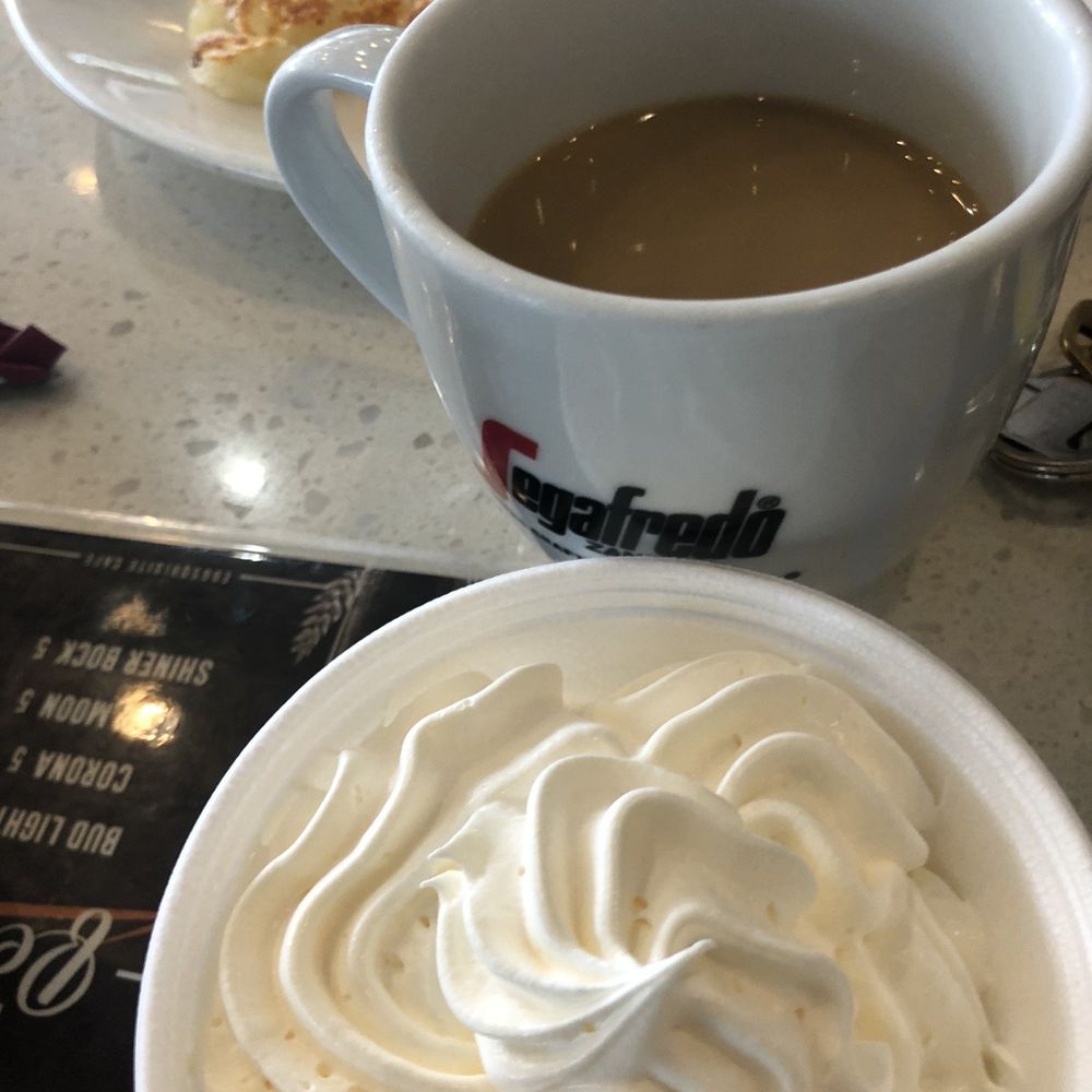 Eggsquisite Cafe - Side order whipped cream and coffee in the back - Breakfast & Brunch Near Me - Frisco, Texas