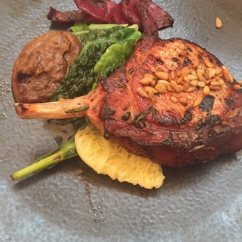 NOPI - Pork chop with spring vegetable. - Mediterranean Near Me - London, XGL NOPI - Pork chop with spring vegetable. - Mediterranean Near Me - London, XGL
