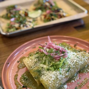 El Kapitan - Enchilada with carnitas and verde sauce (front), vegetarian tacos (back) - Food Trucks Near Me - Rochester, New York