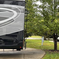 American Heritage RV Park - Tree prevents you being able to back in any further.