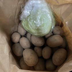 Ekne Gårds Produkter - Potatoes and a head of lettuce.