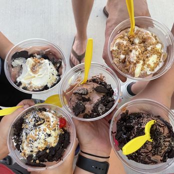 Andy's Frozen Custard - a group of people holding cups of ice cream - Ice Cream & Frozen Yogurt Near Me - Olathe, Kansas