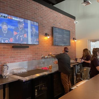 Brewery Thirty-Three - a man and a woman at a bar - Breweries Near Me - Riverton, New Jersey