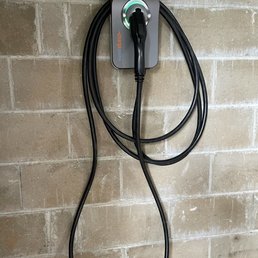 EV Charger mounted in the garage EV Charger mounted in the garage