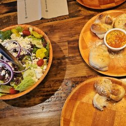 Oceanside Pizza - Cocoa Beach - Large salad and Naan bread  . Salad is plenty filling. Good portion...
