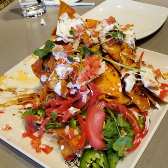 Guy Fieri's Branson Kitchen + Bar - TRASH CAN NACHOS - Bars Near Me - Branson, Missouri Guy Fieri's Branson Kitchen + Bar - TRASH CAN NACHOS - Bars Near Me - Branson, Missouri