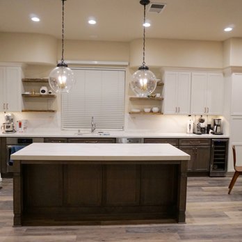 Enns Construction - a kitchen with a center island - General Contractors Near Me Enns Construction - a kitchen with a center island - General Contractors Near Me
