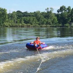 Cozy Corner Campground - Tubing behind the rented pontoon!