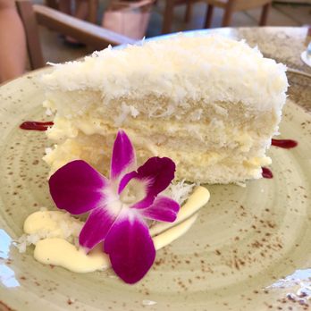 House Without A Key - Signature coconut cake which recipe was created by Mark Okumura, former pastry chef. Must have here - Seafood Near Me - Honolulu, Hawaii