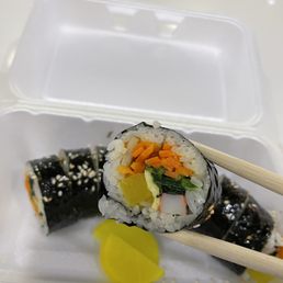 sushi roll with chopsticks sushi roll with chopsticks