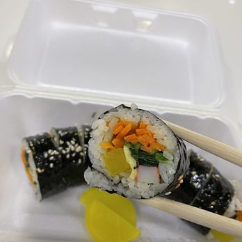 Kim's Kitchen - sushi roll with chopsticks - Korean Near Me - Markham, Ontario Kim's Kitchen - sushi roll with chopsticks - Korean Near Me - Markham, Ontario