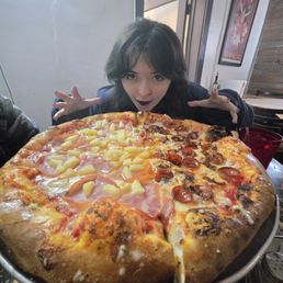 Half pineapple Canadian bacon and half pep and normal bacon and a hungry hungry individual