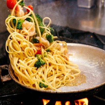 Merrill & Houston's Steak Joint - a wok of pasta being cooked - Steakhouses Near Me - Beloit, Wisconsin