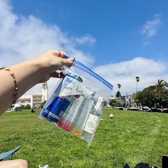 Mr. Liquor - a woman sitting on a blanket in a park - Beer, Wine & Spirits Near Me - San Francisco, California Mr. Liquor - a woman sitting on a blanket in a park - Beer, Wine & Spirits Near Me - San Francisco, California