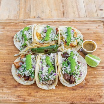 La Salsa Verde - four tacos on a cutting board - Latin American Near Me - Riviera Beach, Florida