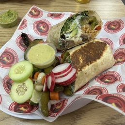 Cabeza burrito with plenty of goodies from the salsa bar. Cabeza burrito with plenty of goodies from the salsa bar.