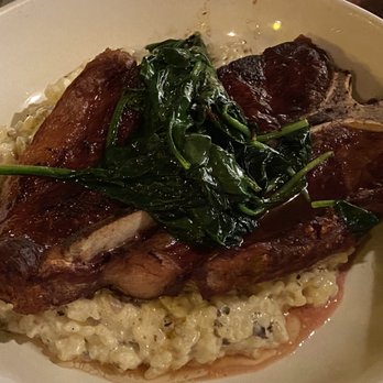 Luciano's - Porterhouse Steak over Mushroom Risotto with Wilted Spinach. - Italian Near Me - Elko, Nevada