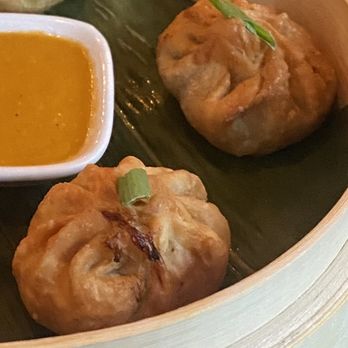 Oorja - Chilli Momo fried chicken dumplings with a tomato chutney dipping sauce. Amazing! - Cocktail Bars Near Me - Montreal, Quebec