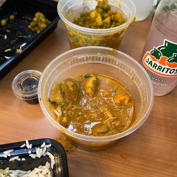 Punjabi restaurant - a bowl of curry and a container of rice - Indian Near Me - Okemah, Oklahoma Punjabi restaurant - a bowl of curry and a container of rice - Indian Near Me - Okemah, Oklahoma