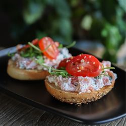 Knowledge Perk Coffee - Chopped Salmon Bagel - Bagel of choice with a mixture of salmon, capers, cream cheese, and seasonings, topped with arugula and tomato