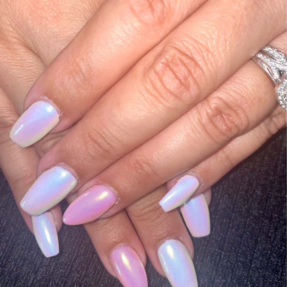 Unicorn chrome nails done by John . Unicorn chrome nails done by John .
