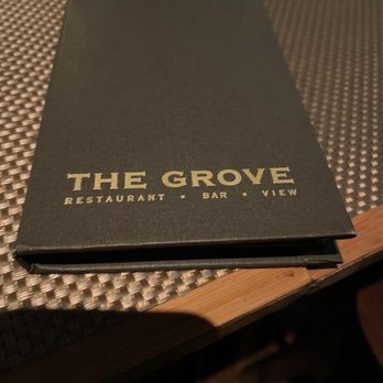 The Grove - a menu on a table - New American Near Me - Houston, Texas