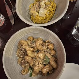 Lumache with pork and beef bolognese, parmesan (front), Bucatini, carrot sour cream, gruyère, poppy seed, pumpkin seed oil  (Back)