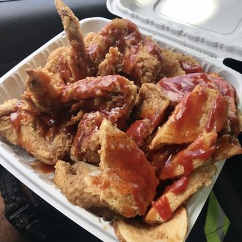 Smokey's - a tray of chicken wings with ketchup - American Near Me - Washington, DC, District of Columbia