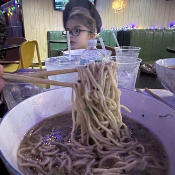 Weems Ramen - a woman eating a bowl of ramen - Ramen Near Me - Charleston, South Carolina Weems Ramen - a woman eating a bowl of ramen - Ramen Near Me - Charleston, South Carolina