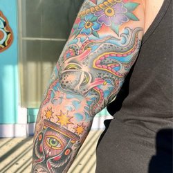 Fine Line Tattoo - Back of arm, octopus/kraken, hourglass.