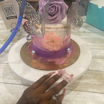 Cake & Sip Atlanta - a woman's hand holding a cup of coffee - Do-It-Yourself Food Near Me