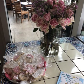 Glitz Bakery - a vase of flowers and a book on a table - Desserts Near Me - Benbrook, Texas Glitz Bakery - a vase of flowers and a book on a table - Desserts Near Me - Benbrook, Texas