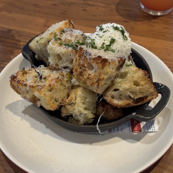 North Italia - The infamous White Truffle Garlic Bread. That blob you see looking like mashed potatoes is their homemade ricotta. Hits every time. - Italian Near Me - Plano, Texas