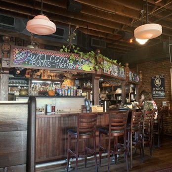 McMenamins Boon's Treasury - a bar with wooden chairs - Bars Near Me - Salem, Oregon