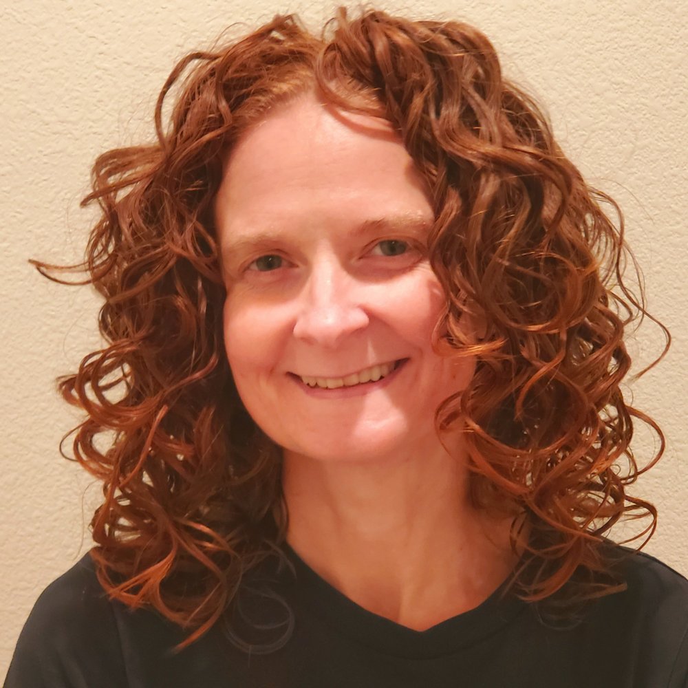 You'd be smiling too if Kelli cut your curls! :)