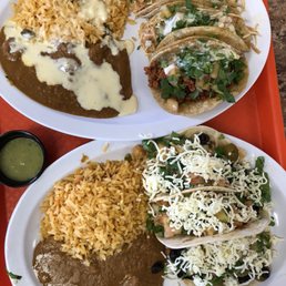 two plates of mexican food two plates of mexican food