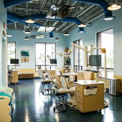High House Pediatric Dentistry - Visit Wannabrusha Bay with a floor like the ocean and a TV over each chair.