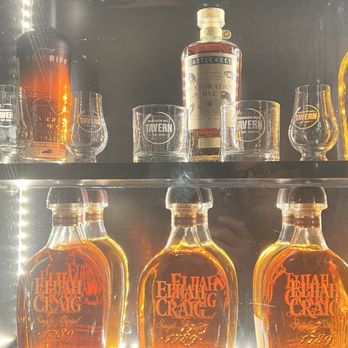Windsor Mill Tavern - Showcase of bourbon's and whiskey's in the foyer of the restaurant. Elijah Craig single malt is a good choice for any occasion. - Bars Near Me - Windsor, Colorado