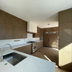 Santa Fe Kitchen Design - Large kitchen with an efficient layout and plenty of storage and countertop space for a personal chef.