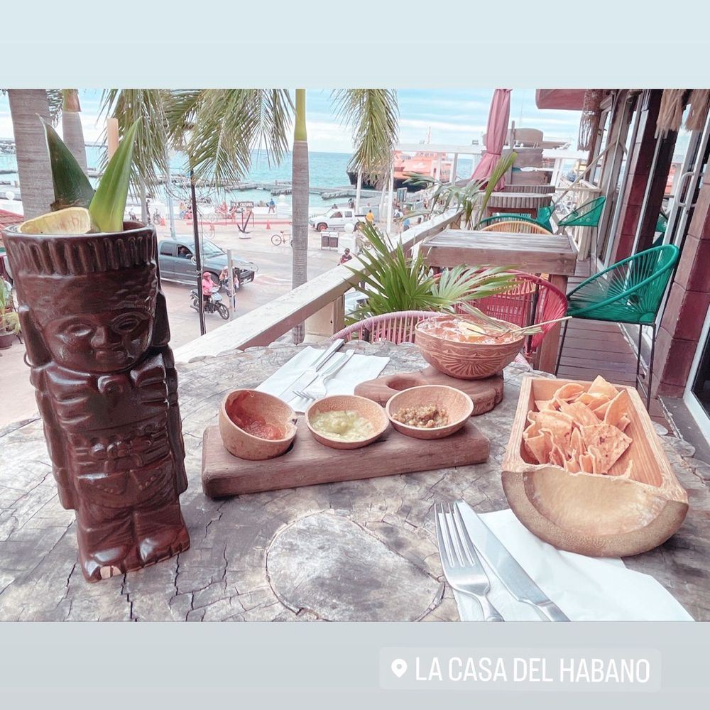 Tiki drink and their house salsa with chips.