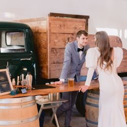 Five Miles Taps & Events - Bride and groom posing in front of a 1952 GMC tap truck