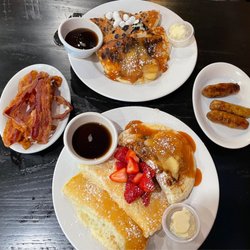 Pj's Pancake House - 2 pancake samplers, side of bacon and pork sausage.