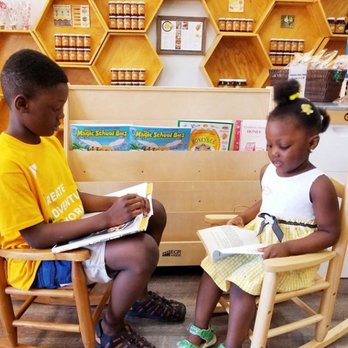 Georgia Honey Farm - two children sitting in rocking chairs reading books - Specialty Food Near Me - Alpharetta, Georgia Georgia Honey Farm - two children sitting in rocking chairs reading books - Specialty Food Near Me - Alpharetta, Georgia
