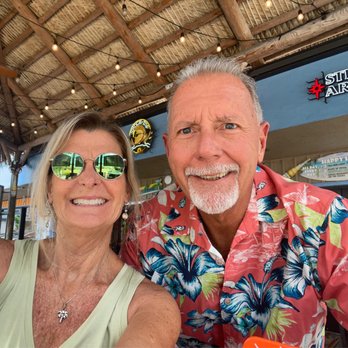 Shells Seafood - Happy Satiated Diners after a great meal at Shell's St Pete Beach's Tiki Bar - Seafood Near Me - St. Pete Beach, Florida