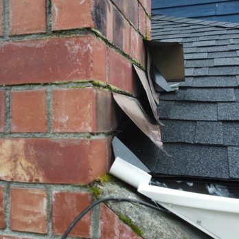 True Blue Roofing And Siding - Tattered chimney flashing. Called dammage "cosmetic" - Roofing Near Me - Maple Valley, Washington True Blue Roofing And Siding - Tattered chimney flashing. Called dammage "cosmetic" - Roofing Near Me - Maple Valley, Washington